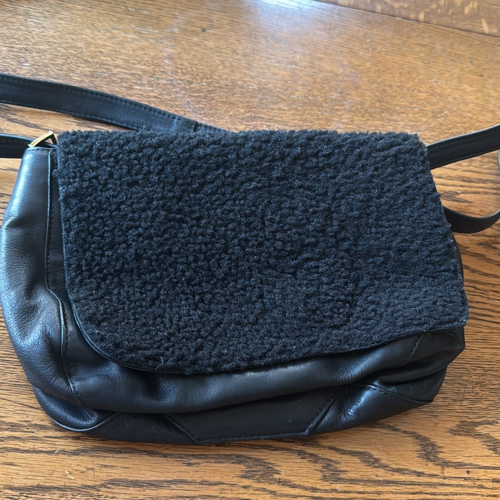 Clare V. Shearling& leather beauty. Wear as a crossbody, shoulder bag or clutch